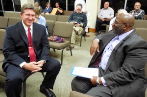 Fernandina Beach Mayor Ed Boner  speaks with Rev. Anthony Daniels, Macedonia AME Church, before the meeting.  Daniels, who delivered the meeting invocation, is convening a community meeting at the church on January 5 at 6:00 p.m. to discuss clergy and community leadership in the wake of recent national events.