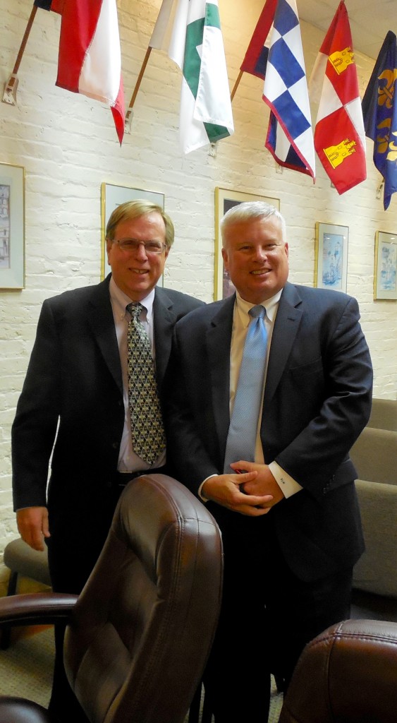 Recruitment consultant Colin Baenziger poses with Dale Martin, Fernandina Beach's next city manager, following FBCC's unanimous vote.